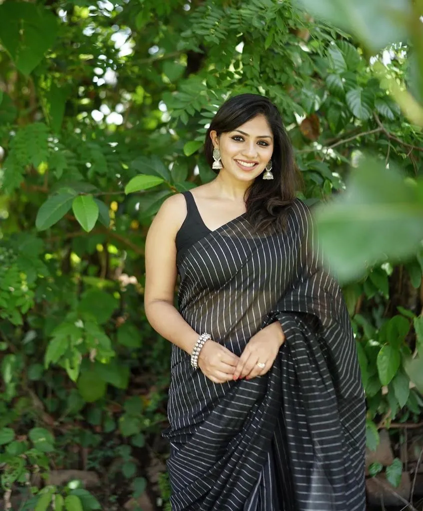 Cynosure Black Soft Silk Saree With Whimsical Blouse Piece