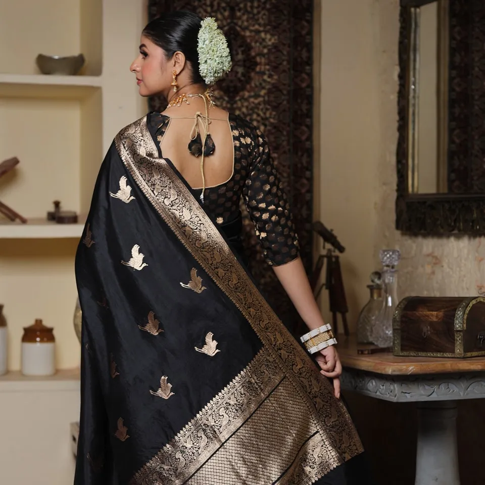 Mesmeric Black Soft Silk Saree With Inspiring Blouse Piece